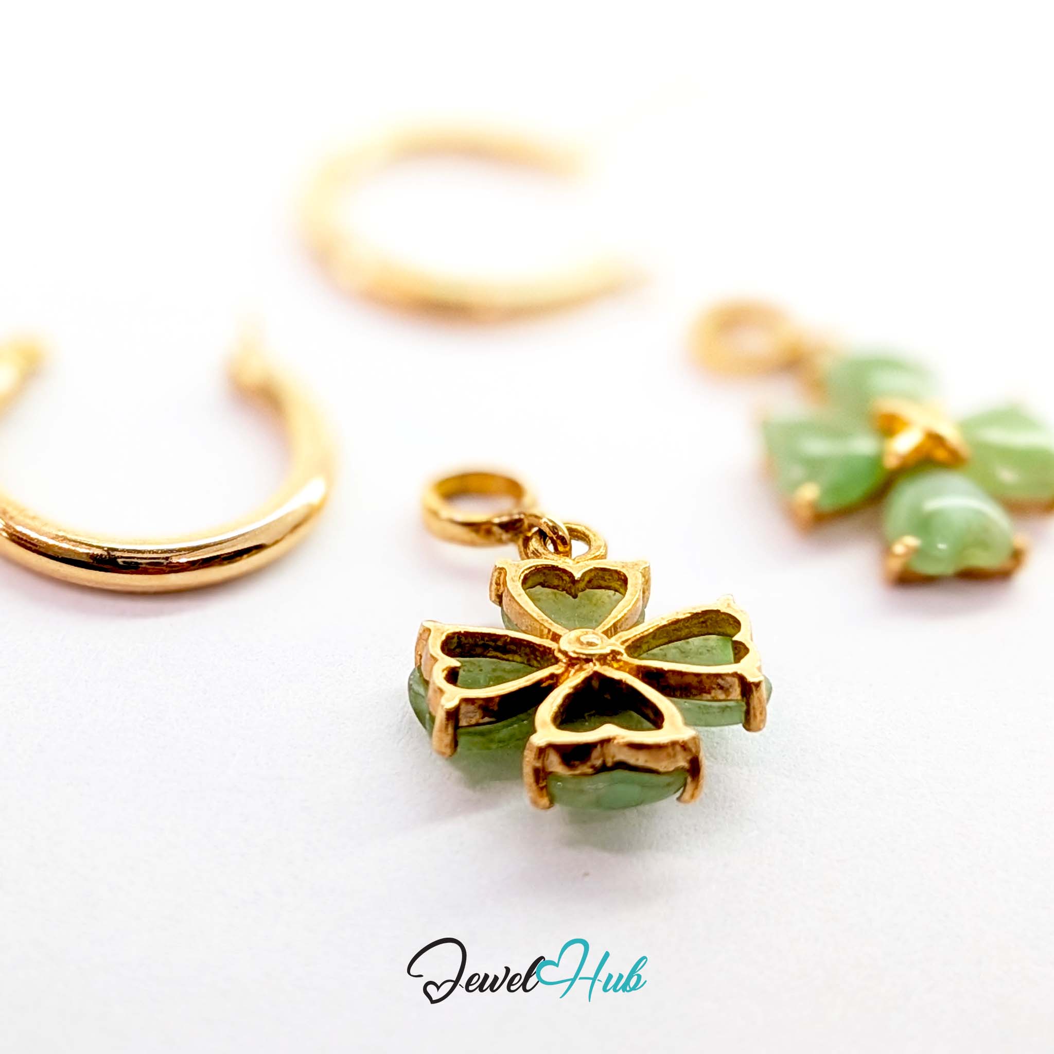 Soft mid green jade with paler natural ground running through the hearts - JewelHub