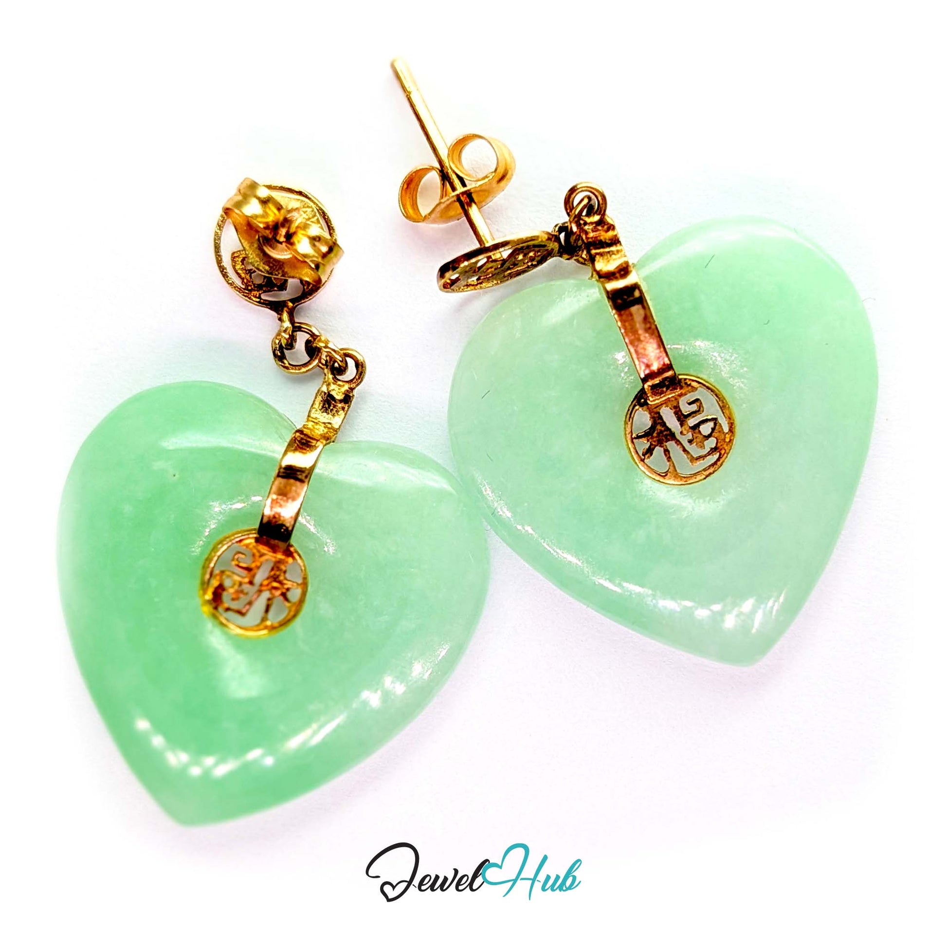 Openwork fu character plaque in 14k gold above the hanging jade heart - JewelHub