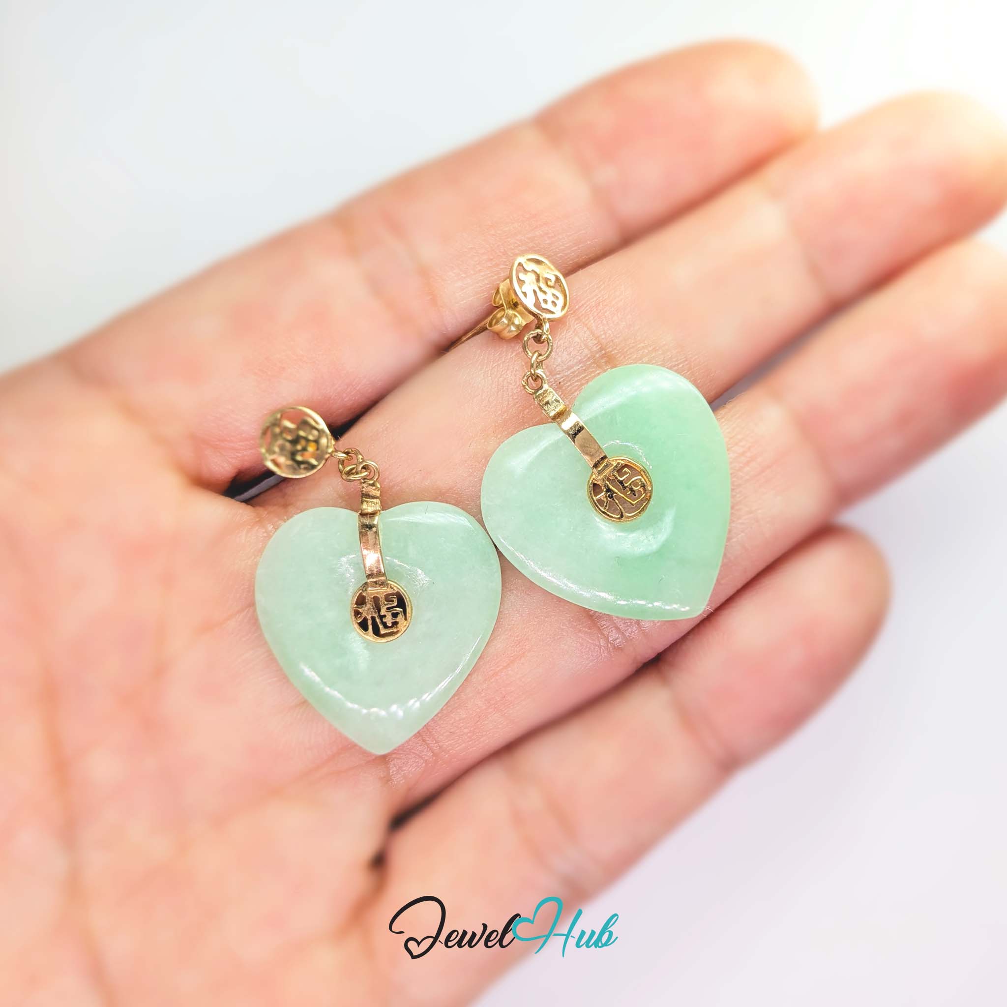 Second fu roundel set on a gold bar across the face of the jade heart - JewelHub