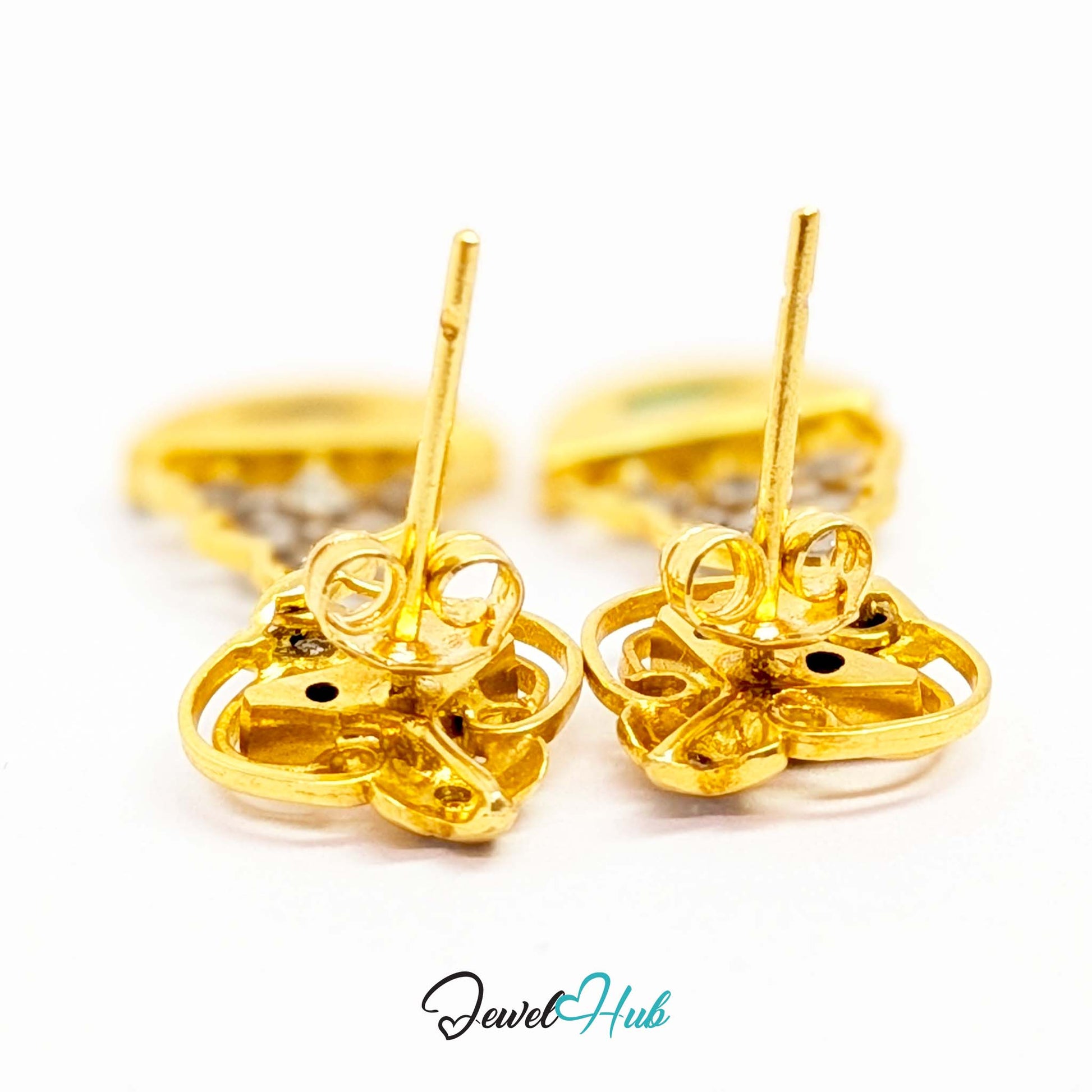 Flat-cut jade panels bezel-set in 18k gold, showing the deepest green in the collection - JewelHub