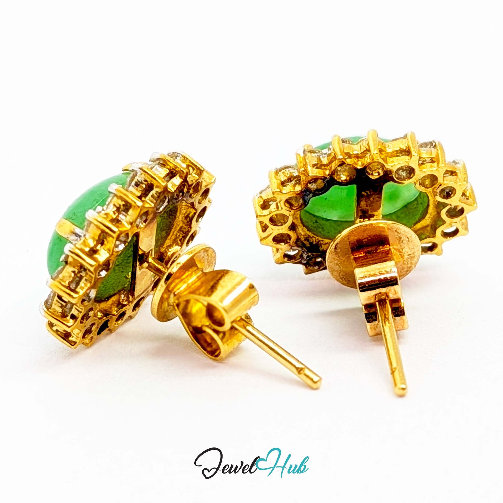 Warm yellow claws against the green stone with a cool white gold diamond surround - JewelHub