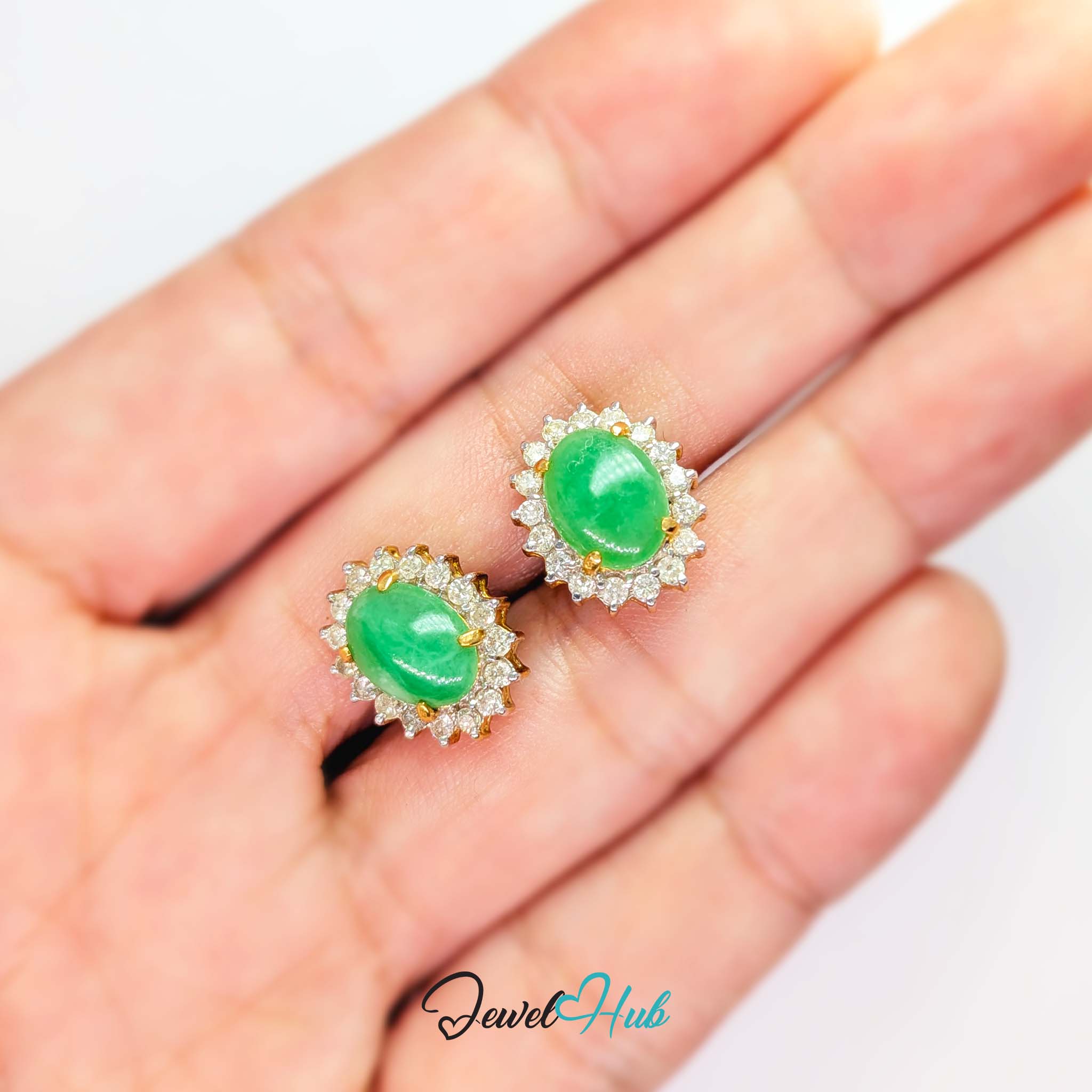 Seventeen round diamonds circling each jade cabochon in an unbroken white gold halo - JewelHub