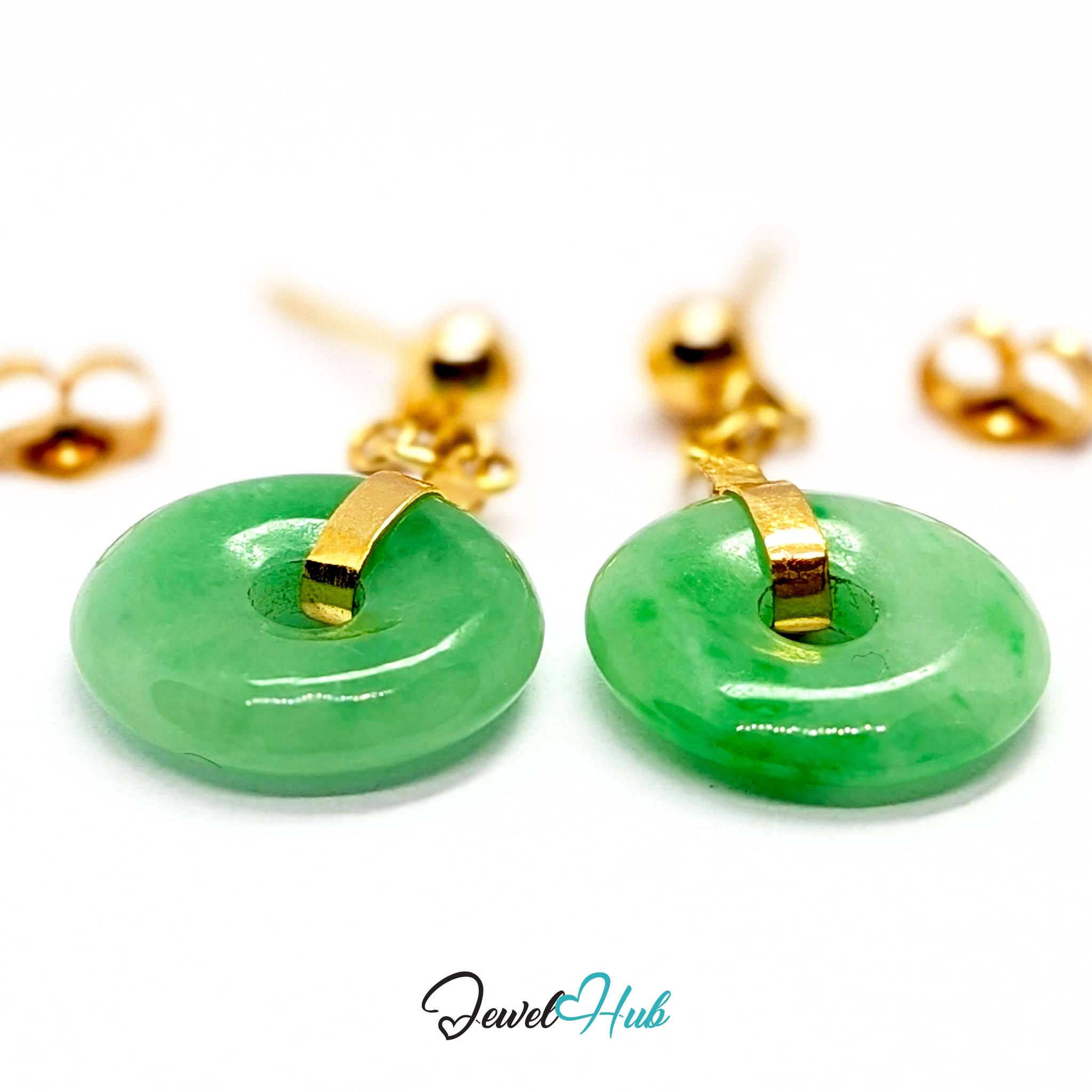 Mottled mid green jade drifting over a paler ground across the 12mm disc - JewelHub