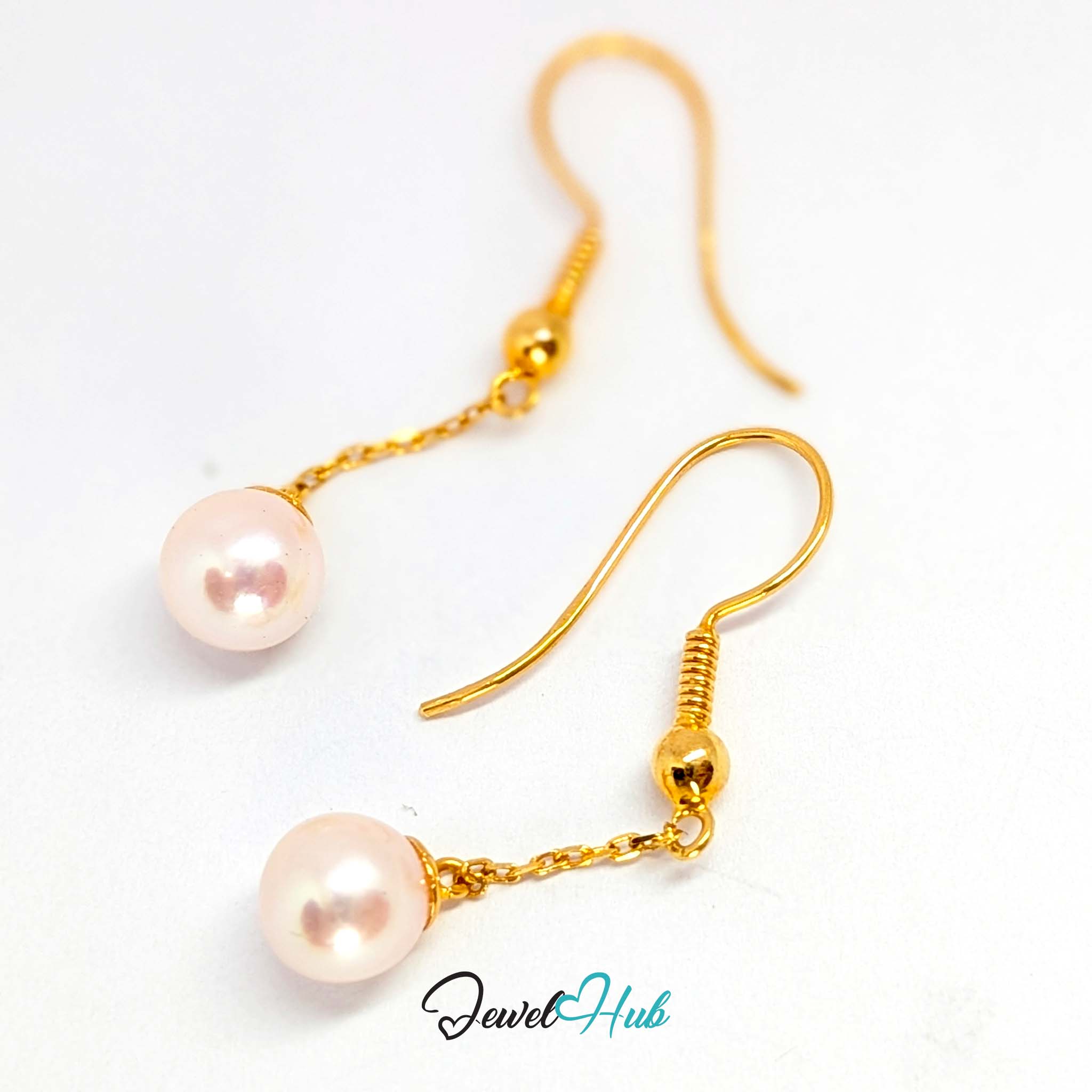 White pearl with a warm rose overtone shifting through the lustre - JewelHub
