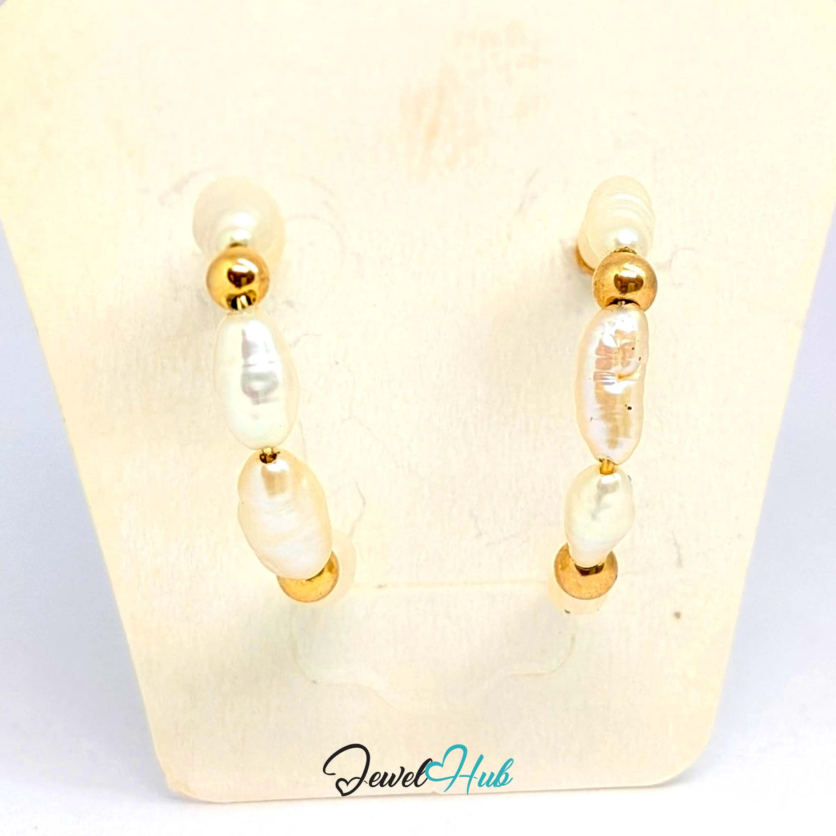 Hand-strung look given by the slight irregularity of each rice pearl - JewelHub