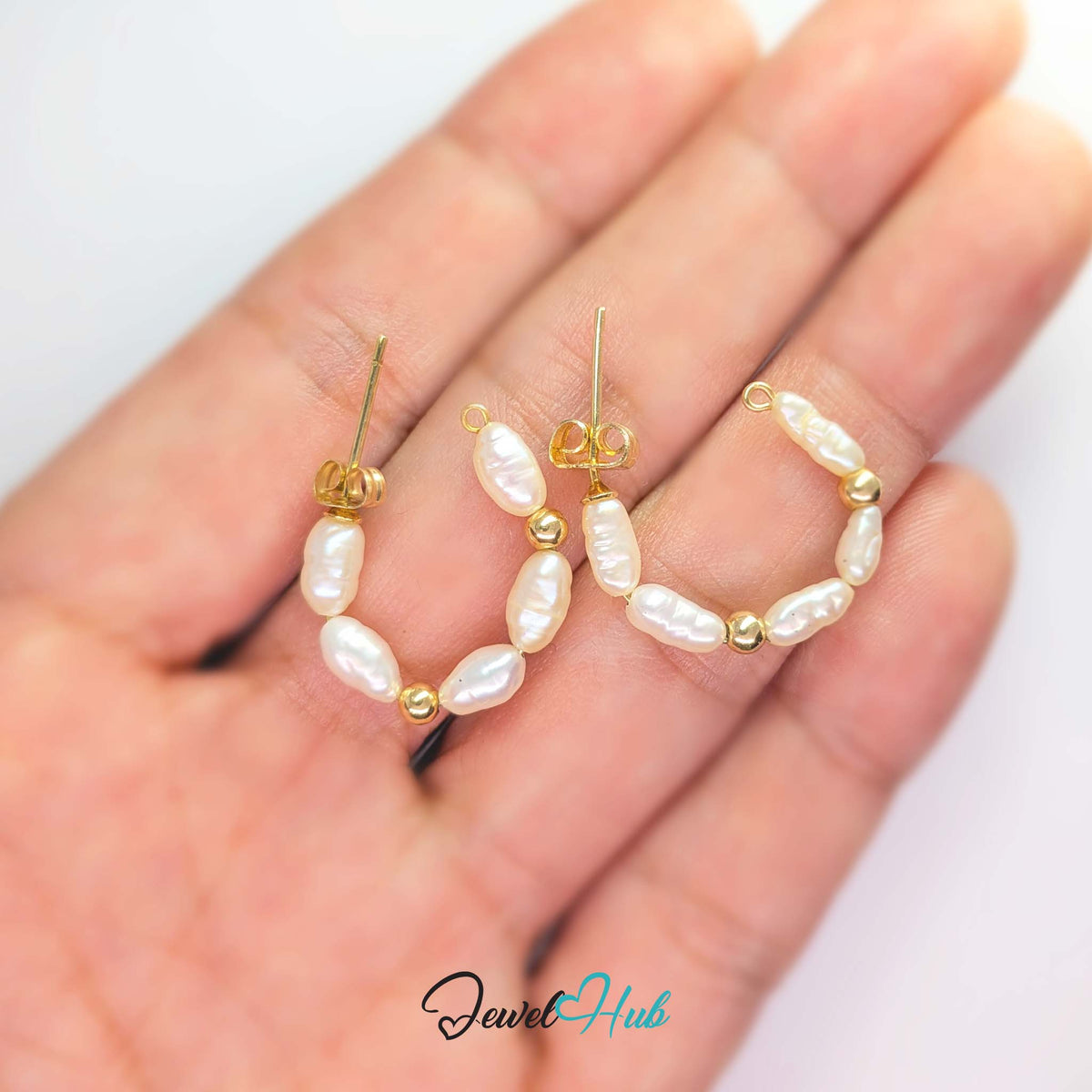 Solid 14k gold post and push-back fitting on the rice pearl cascade studs - JewelHub