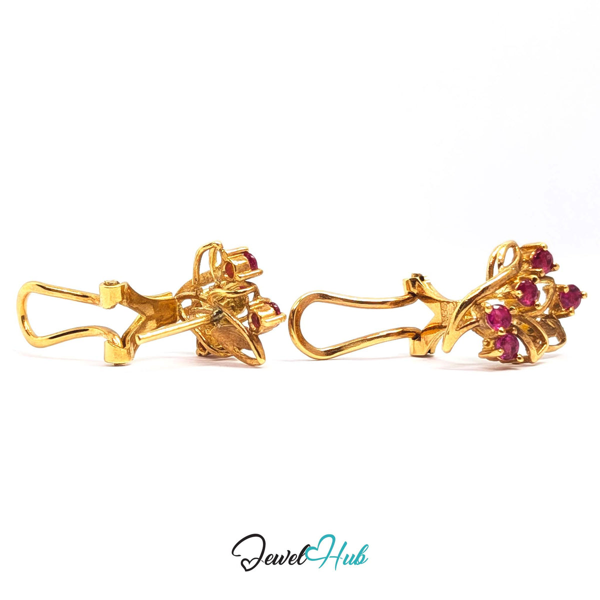 Vivid pinkish red rubies, about 3mm each, claw-set into the gold ribbons - JewelHub