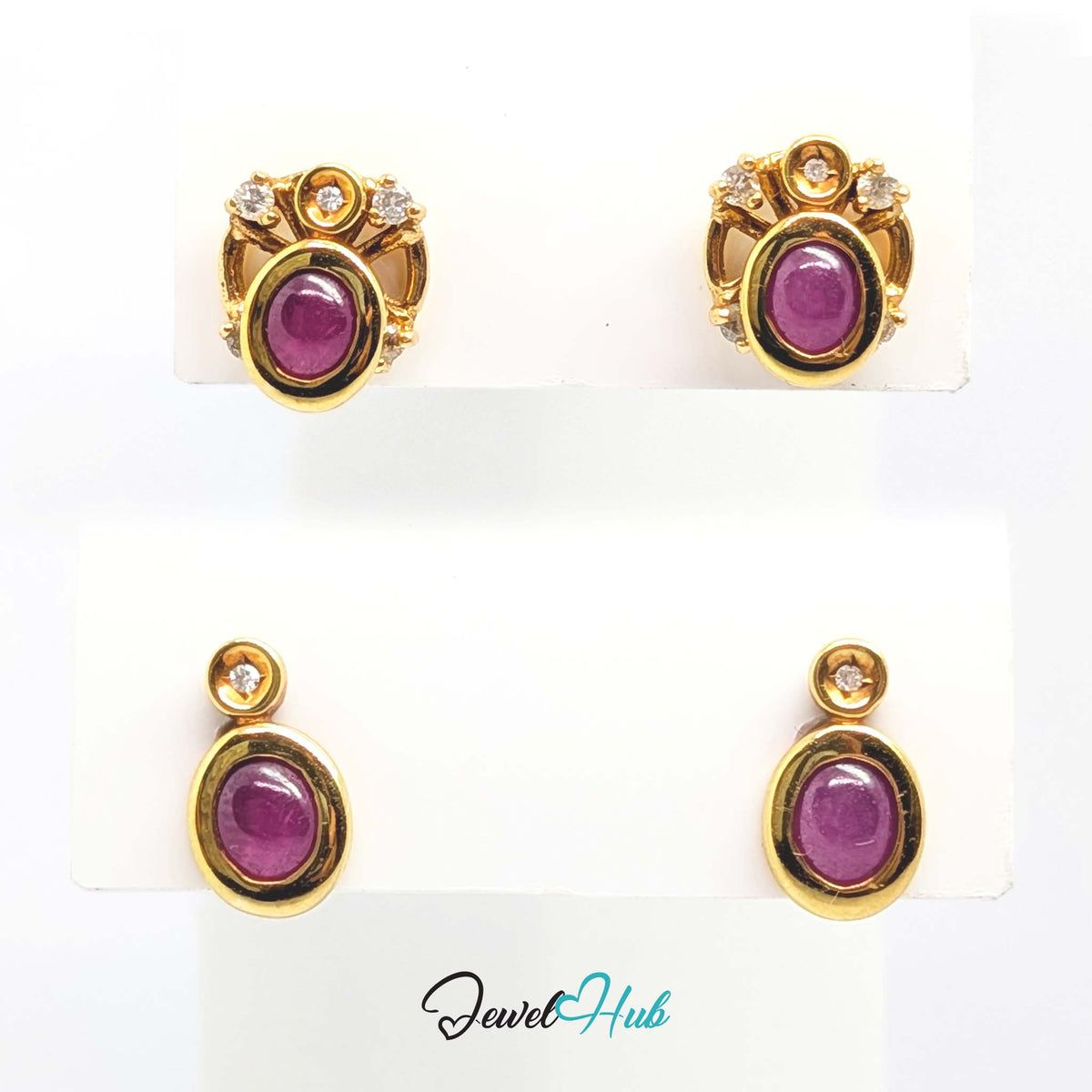 Soft purplish pink ruby domed rather than faceted, showing colour instead of sparkle - JewelHub