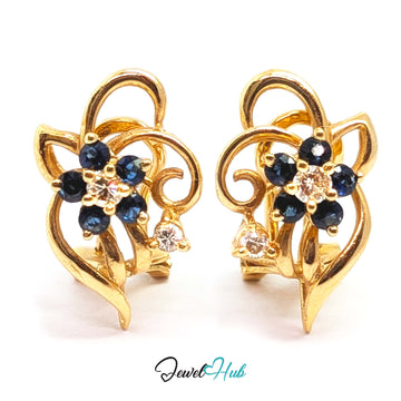 14K gold sapphire and diamond flower earrings, five blue sapphires around a central diamond - JewelHub