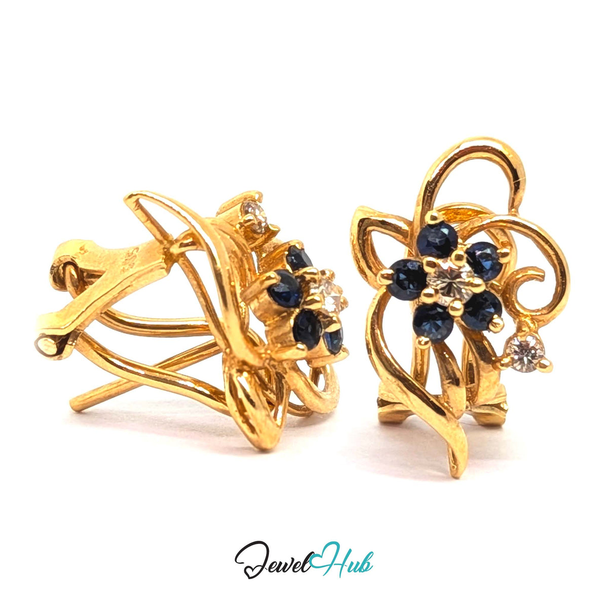 Diamond centre drawing the eye before the surrounding blue registers - JewelHub