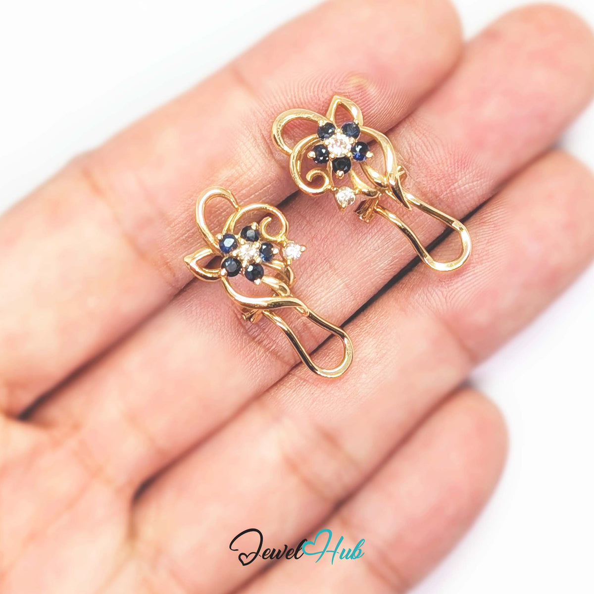 Second small diamond set on its own short stem beside the sapphire bloom - JewelHub