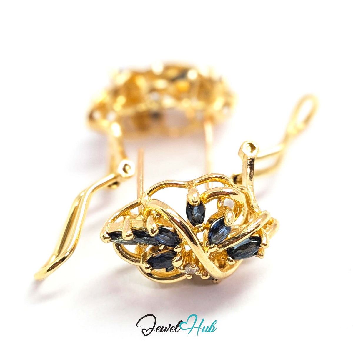 Ten marquise sapphires to each ear arranged in overlapping fans - JewelHub