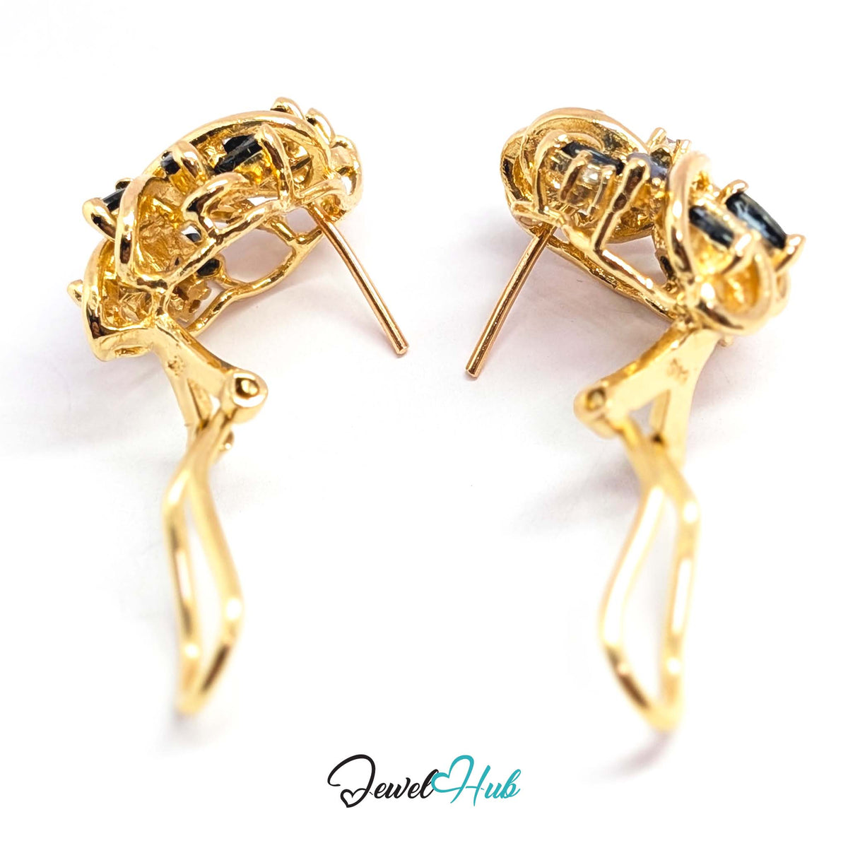 Round diamonds set where the gold ribbons cross on each earring - JewelHub