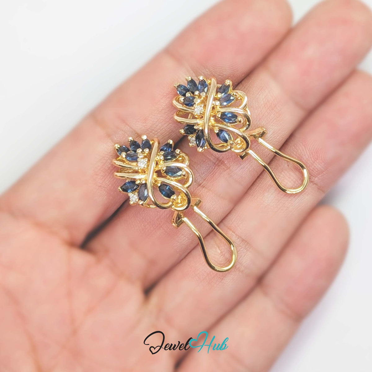 Marquise sapphires reading as leaves growing off a stem rather than as a cluster - JewelHub