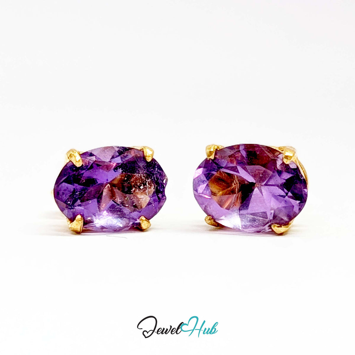 Natural colour zoning visible in bands through the body of the amethyst - JewelHub