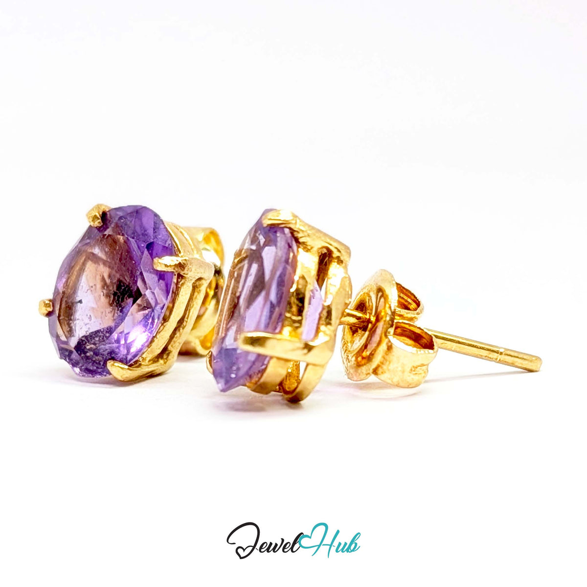 Faint amber flash where light catches the culet of the oval amethyst - JewelHub