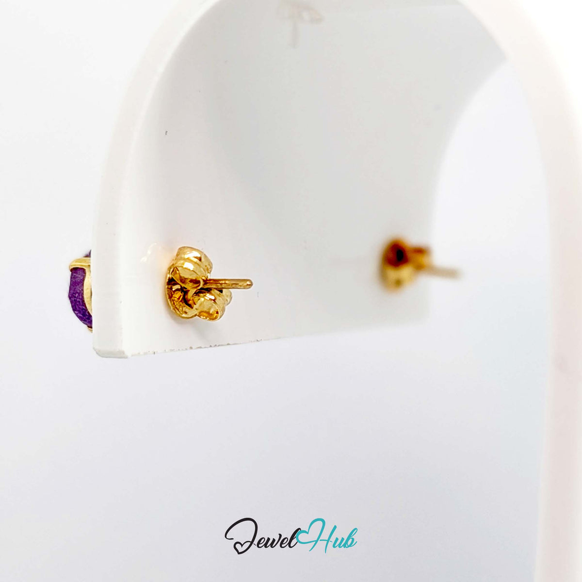 Pair of oval amethyst studs shown together, 1.245 grams for the two - JewelHub