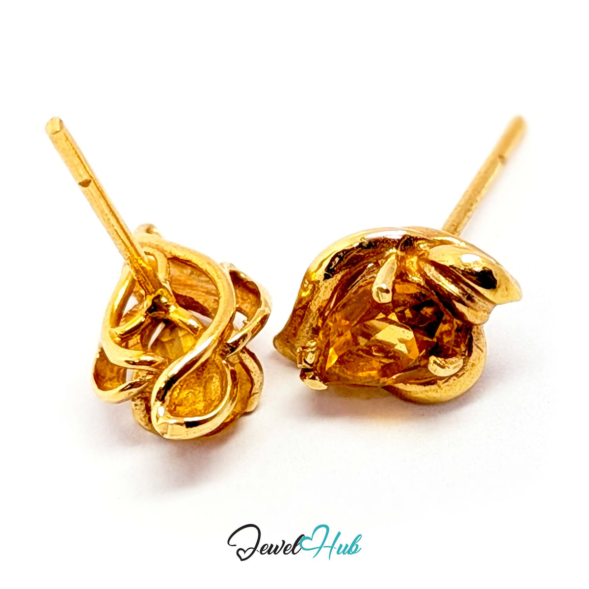 Oval citrine, about 7 x 5mm, claw-set at an angle in 14k gold - JewelHub