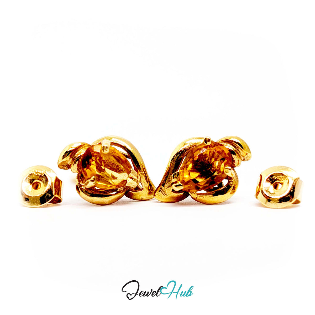 Citrine set tilted within the gold curl so stone and metal catch light separately - JewelHub