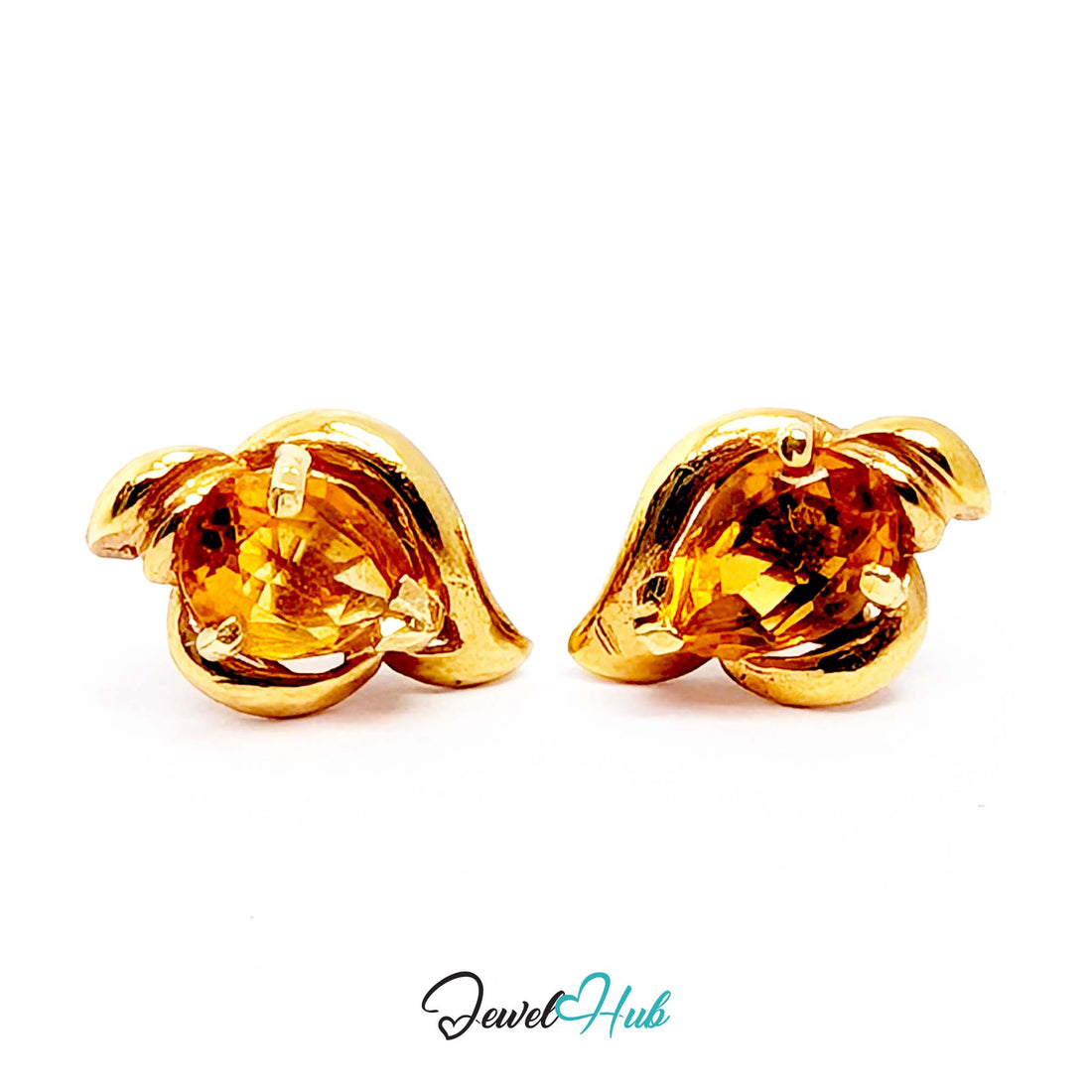 Heavy curl of polished gold folding around the citrine like a wave breaking - JewelHub