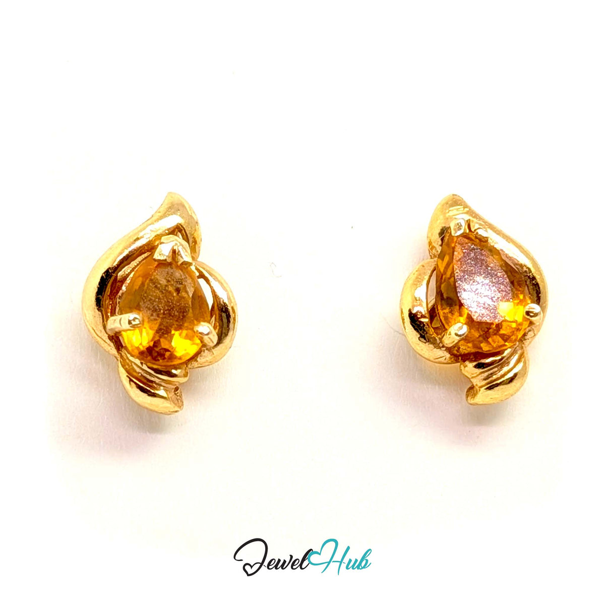 Golden quartz reading like held light against warm yellow gold - JewelHub