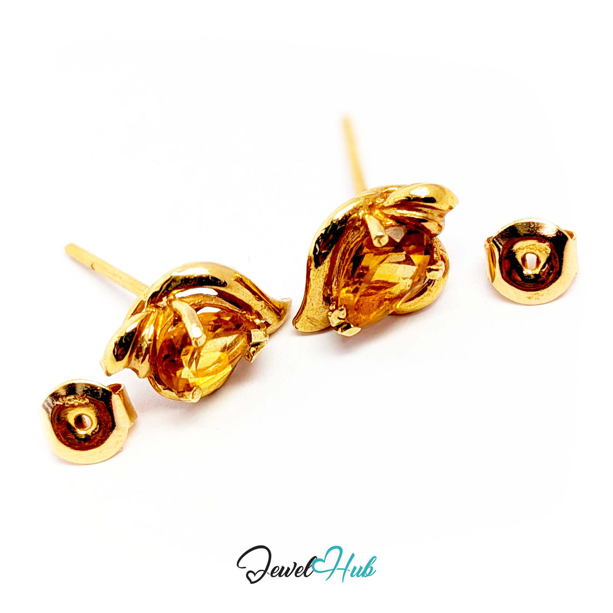 Broad soft mirror polish on the gold against the small flat facets of the stone - JewelHub