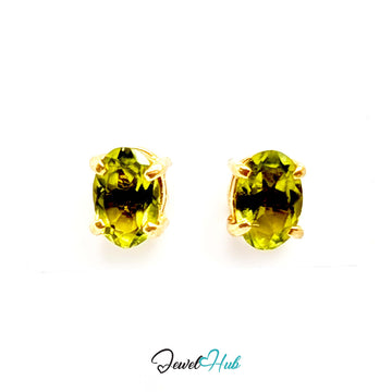 14K gold peridot stud earrings, oval yellow-green stones in plain four-claw settings - JewelHub