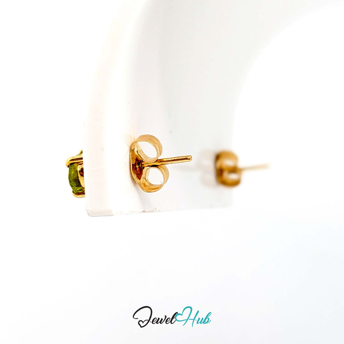 Open-backed minimal setting letting light through the peridot from behind - JewelHub