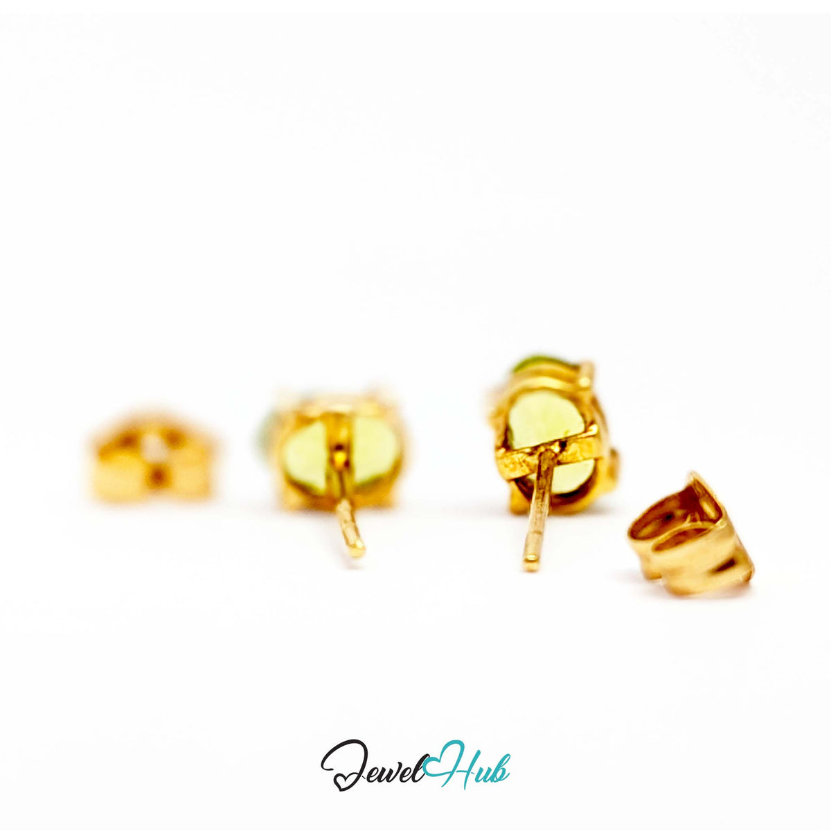 Pair of oval peridot studs shown together, 0.819 grams for the two - JewelHub