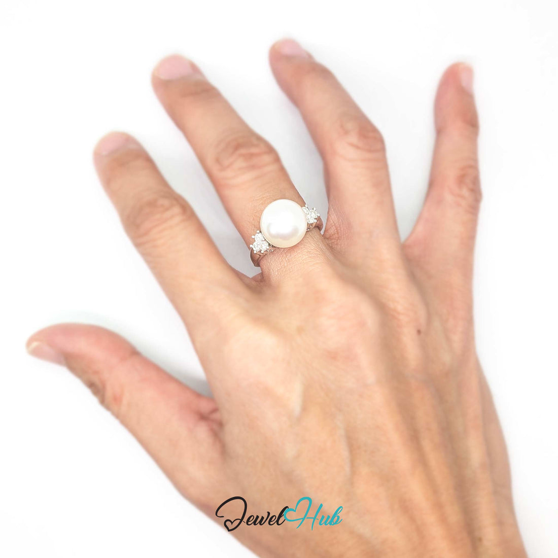 A white freshwater pearl ring with a white gold band accented by small clear gemstones on each side, shown on a white background with a 'JewelHub' watermark at the bottom.