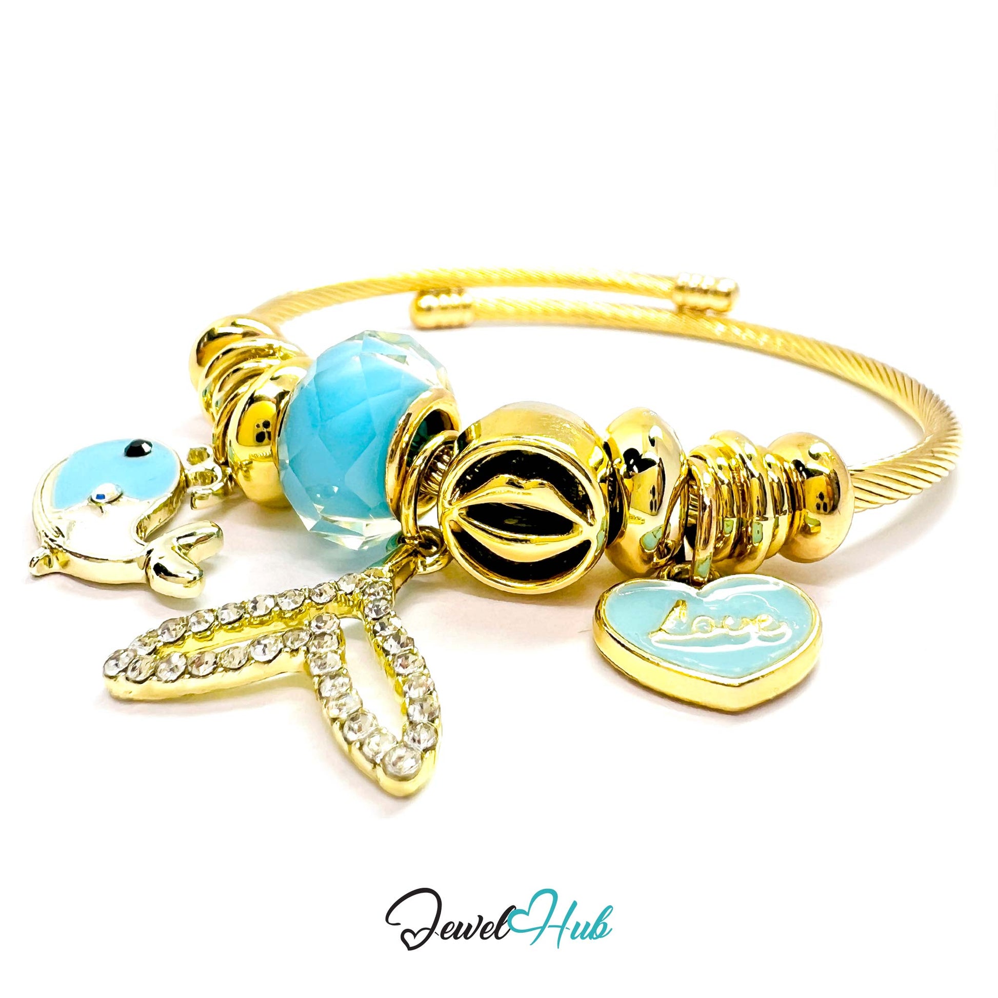 Gold bracelet with blue heart charm and dolphin charm on a white background, branded 'Jewel Hub'.