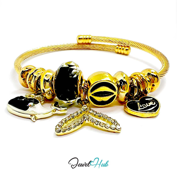 Gold bracelet with various charms on a white background, branded 'Jewel Hub'.