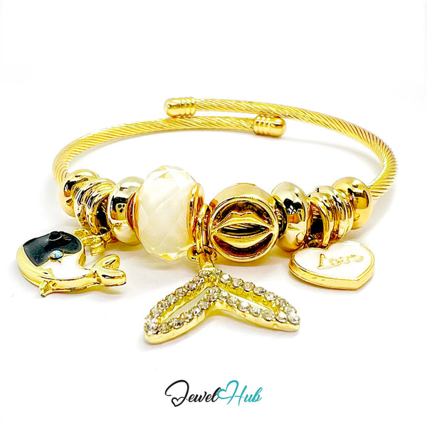 Gold bracelet with various charms on a white background, branded 'Jewel Hub'.