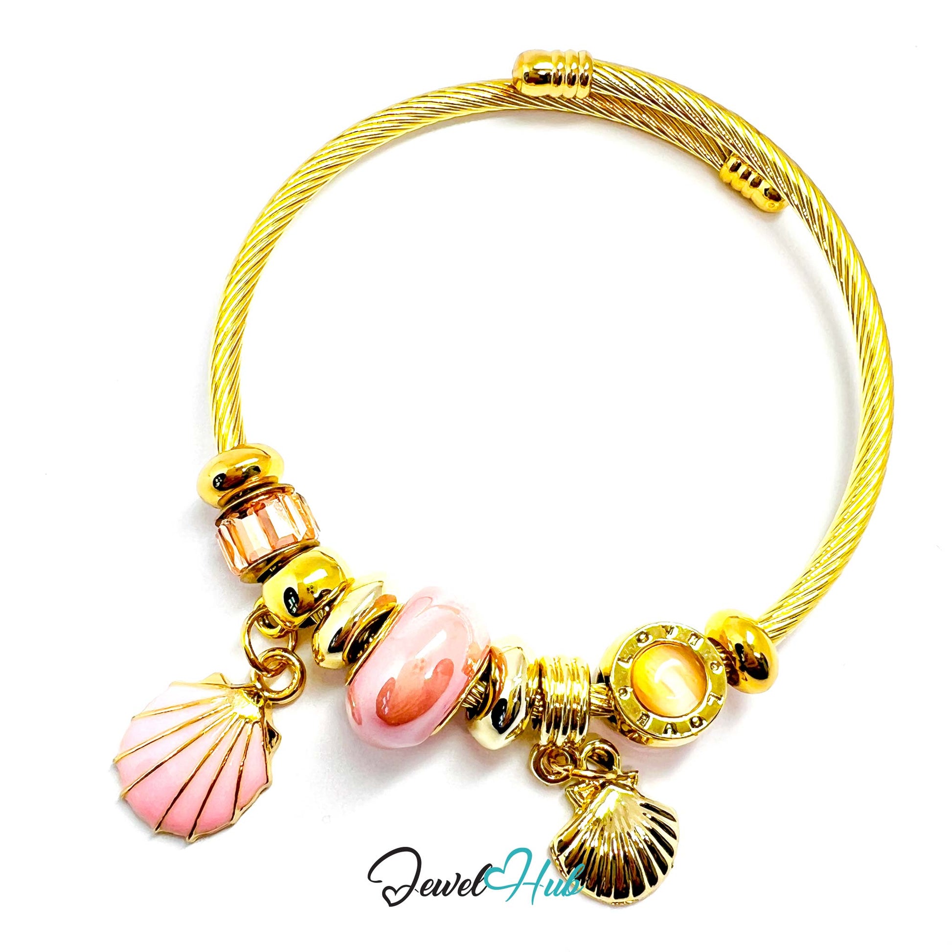 Gold bracelet with pink shell charms on a white background