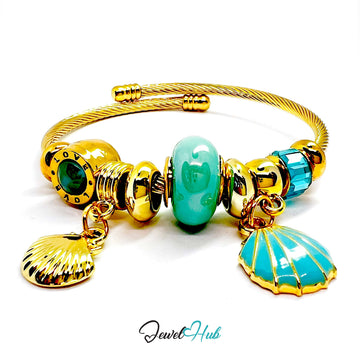 Gold and turquoise bracelet with shell charms on a white background, branded 'Jewel Hub'.