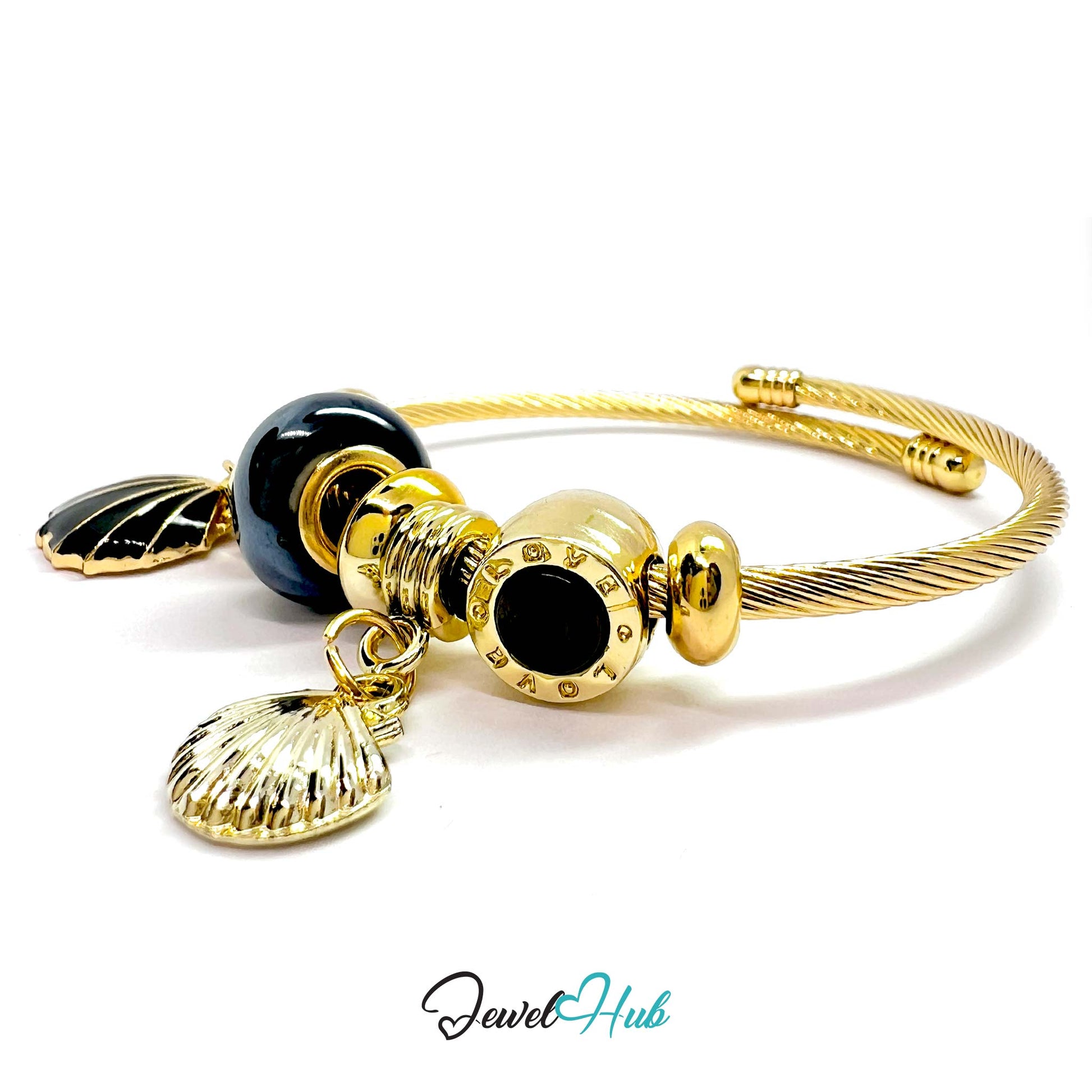 Gold and black beaded bracelet with shell charms on a white background, branded 'Jewel Hub'.
