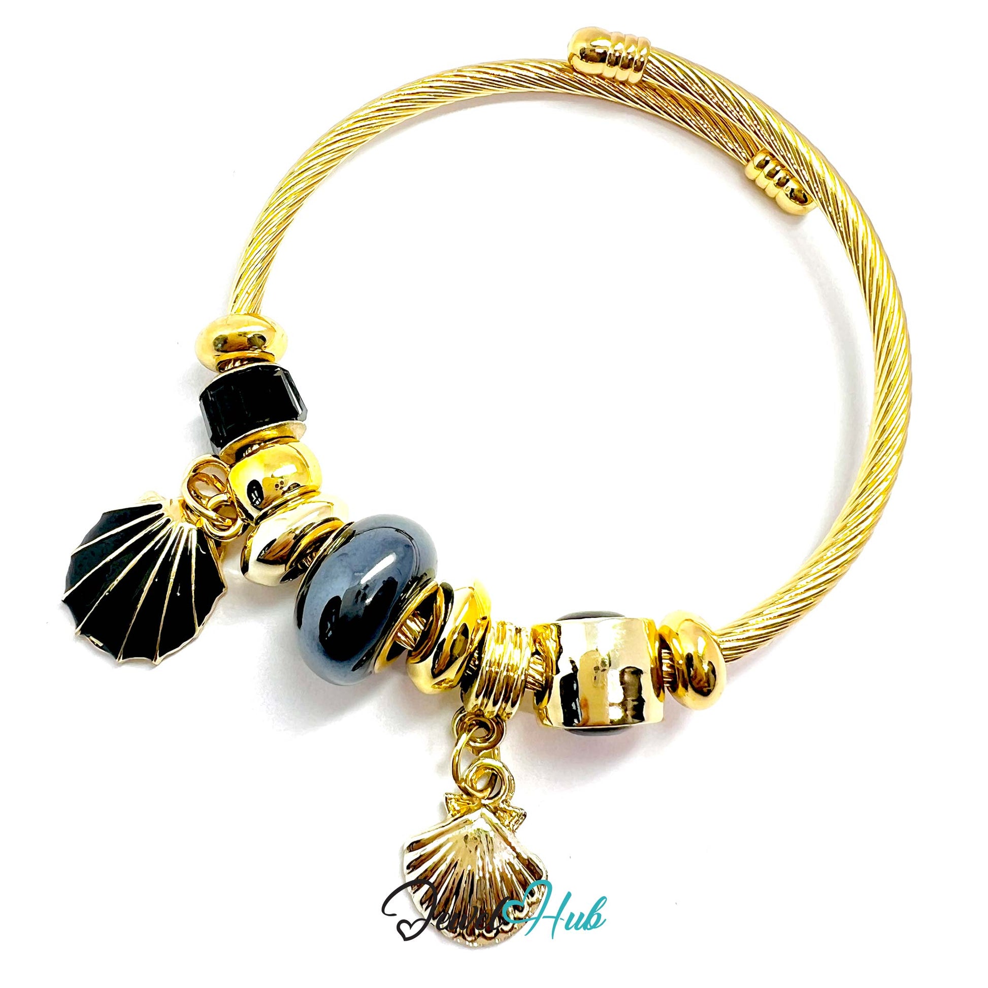 Gold bracelet with black and gray beads on a white background