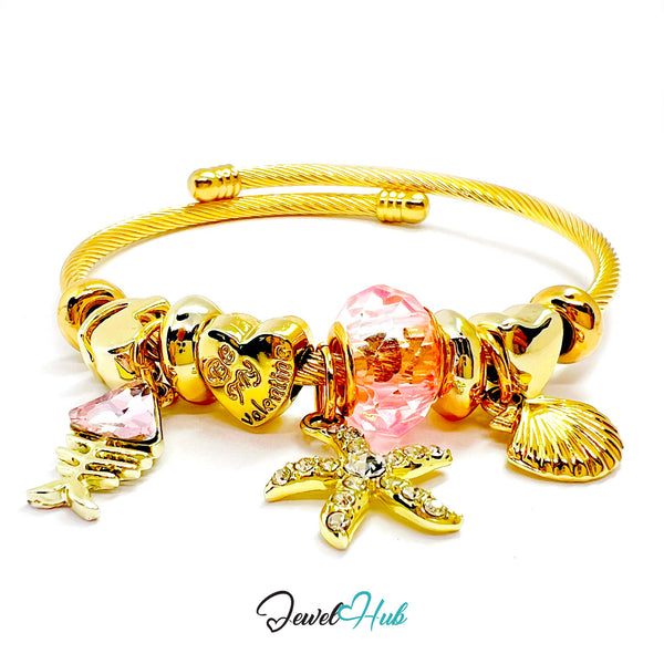 Gold bracelet with various charms on a white background, branded 'Jewel Hub'.