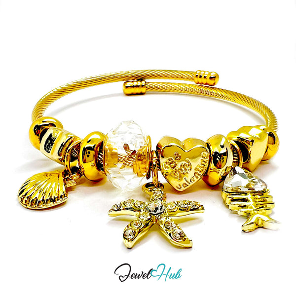 Gold bracelet with various charms on a white background, branded 'Jewel Hub'.
