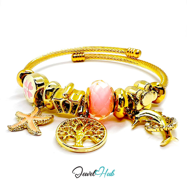 Gold charm bracelet with various charms on a white background, branded 'Jewel Hub'.