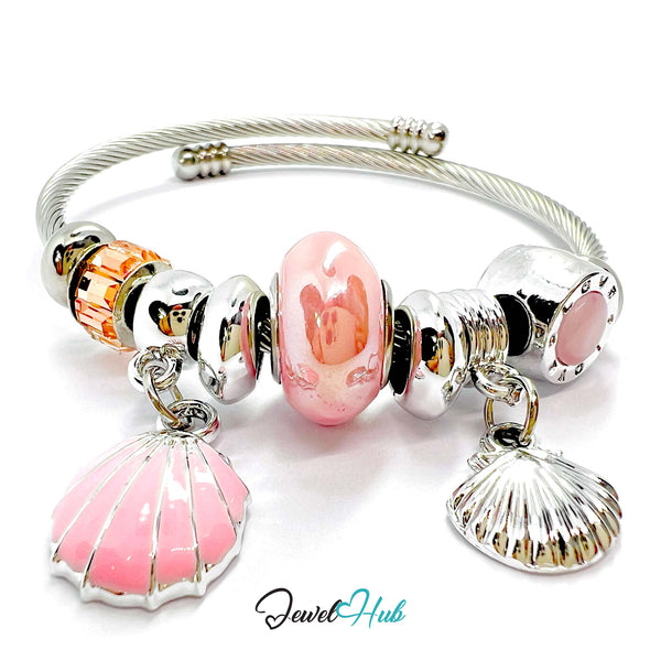 Silver bracelet with pink and gold beads and charms on a white background, branded 'Jewel Hub'.