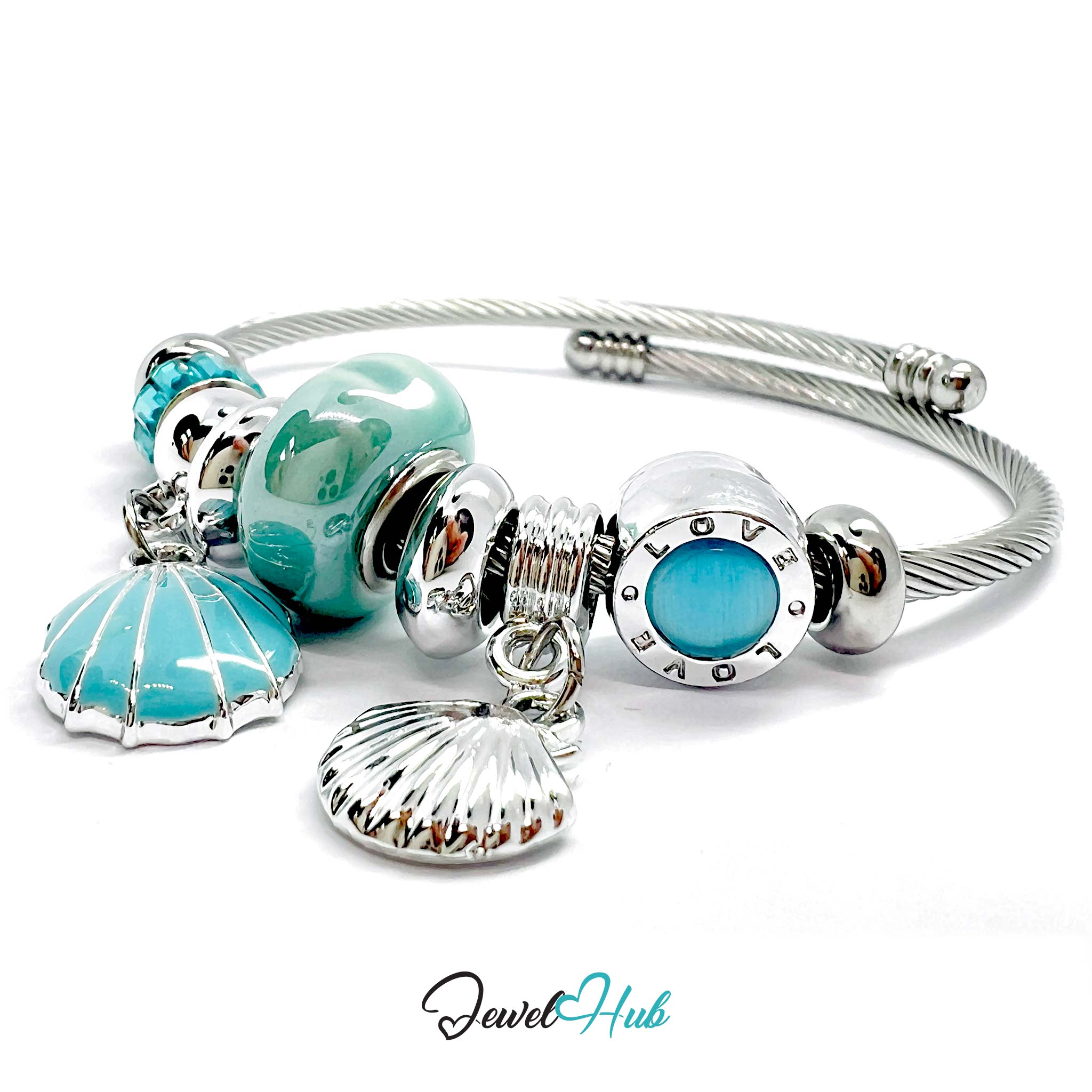 Silver bracelet with turquoise beads and charms on a white background, branded 'Jewel Hub'.