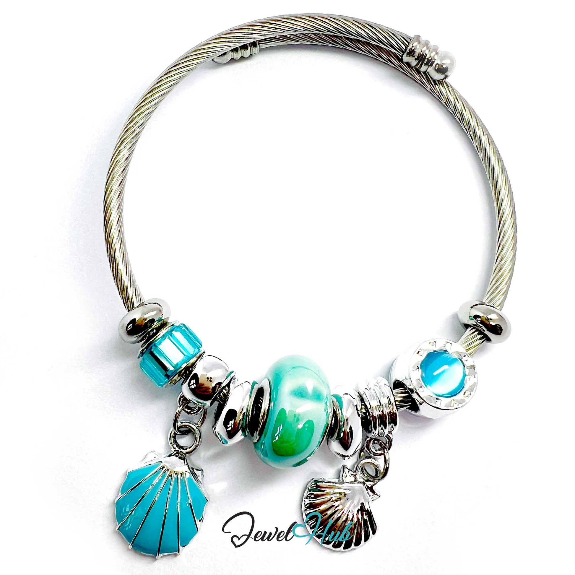 Bracelet with turquoise beads and shell charms on a white background