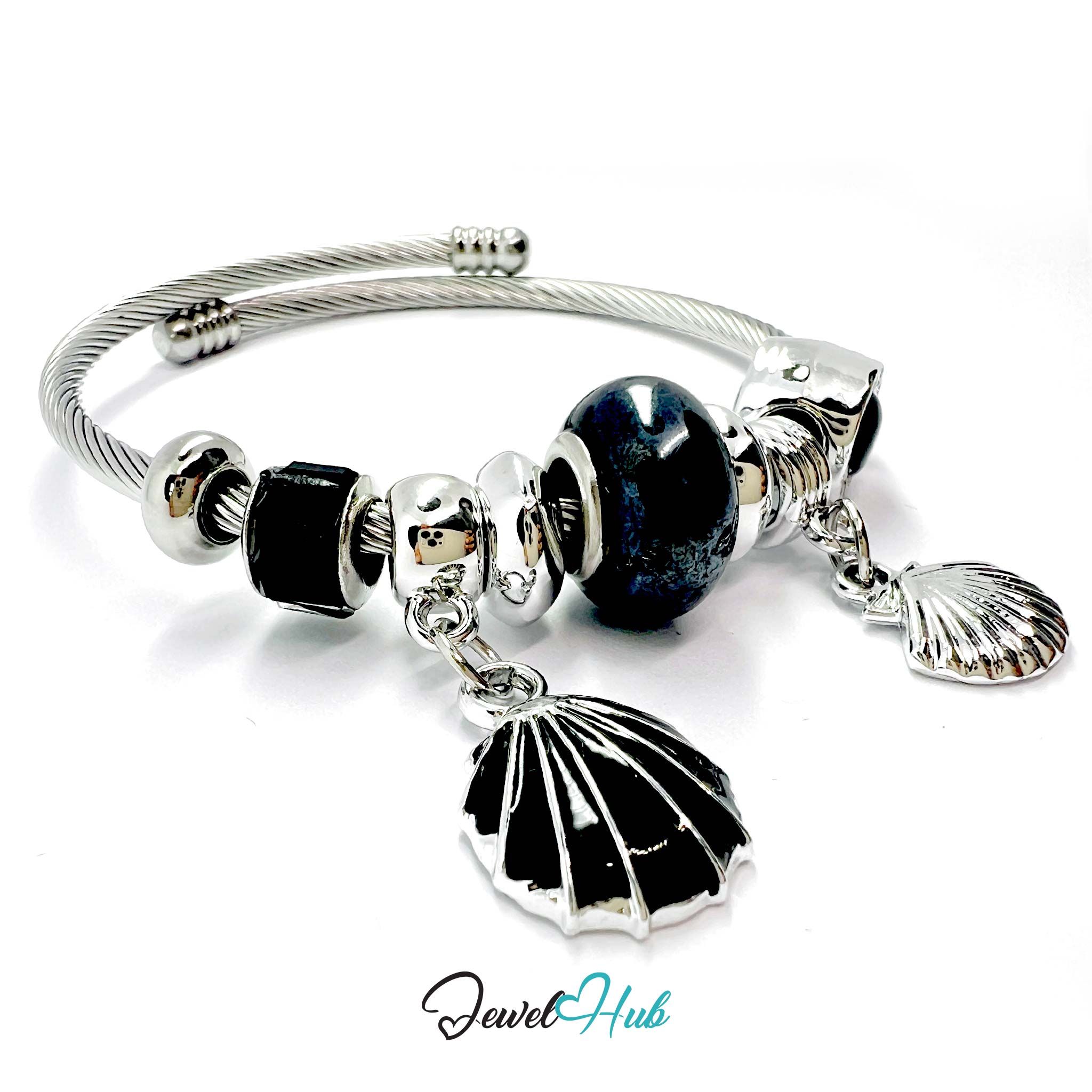 Silver bracelet with black and white beads and shell charms on a white background, branded 'Jewel Hub'.