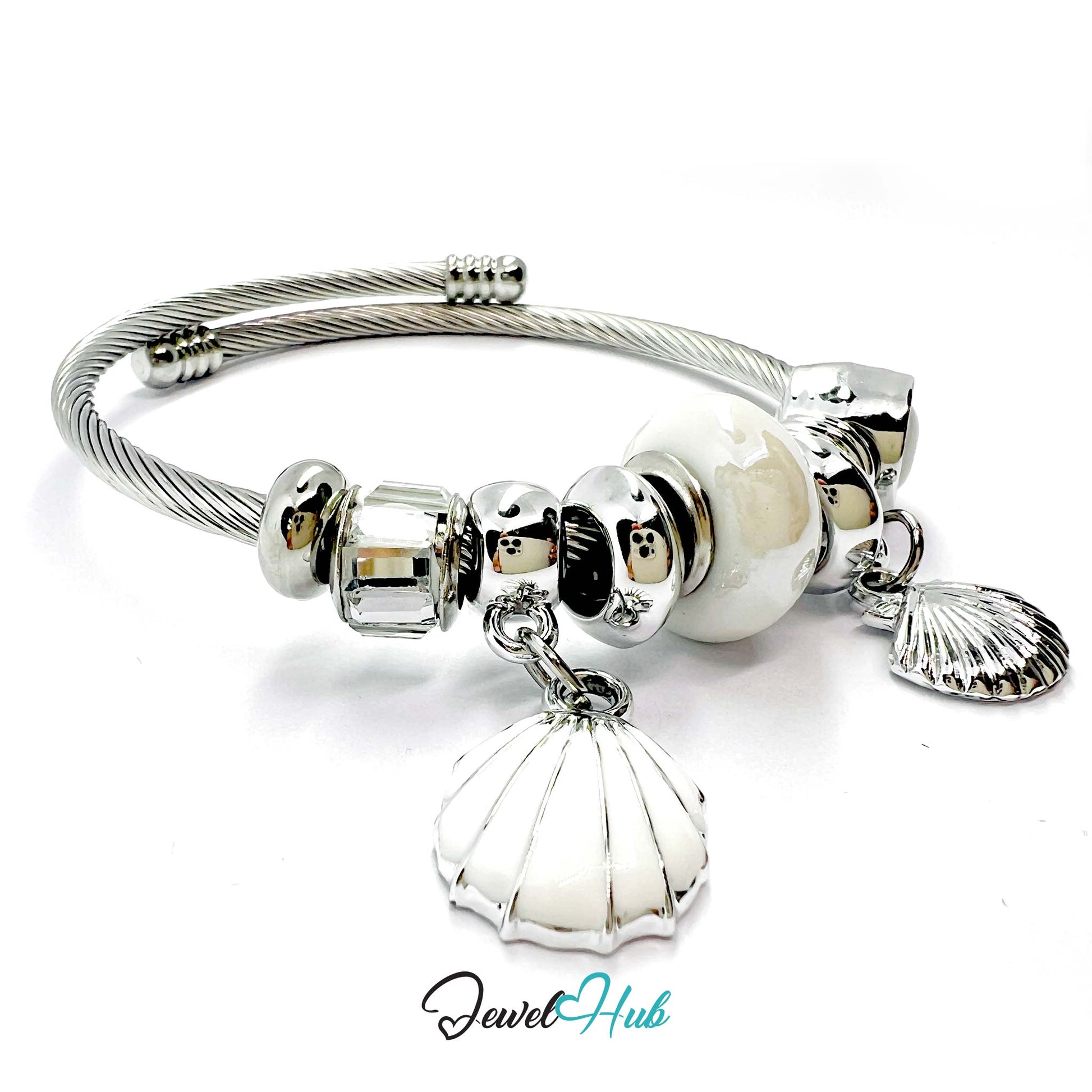Silver bracelet with shell and bead charms on a white background, branded 'Jewel Hub'.