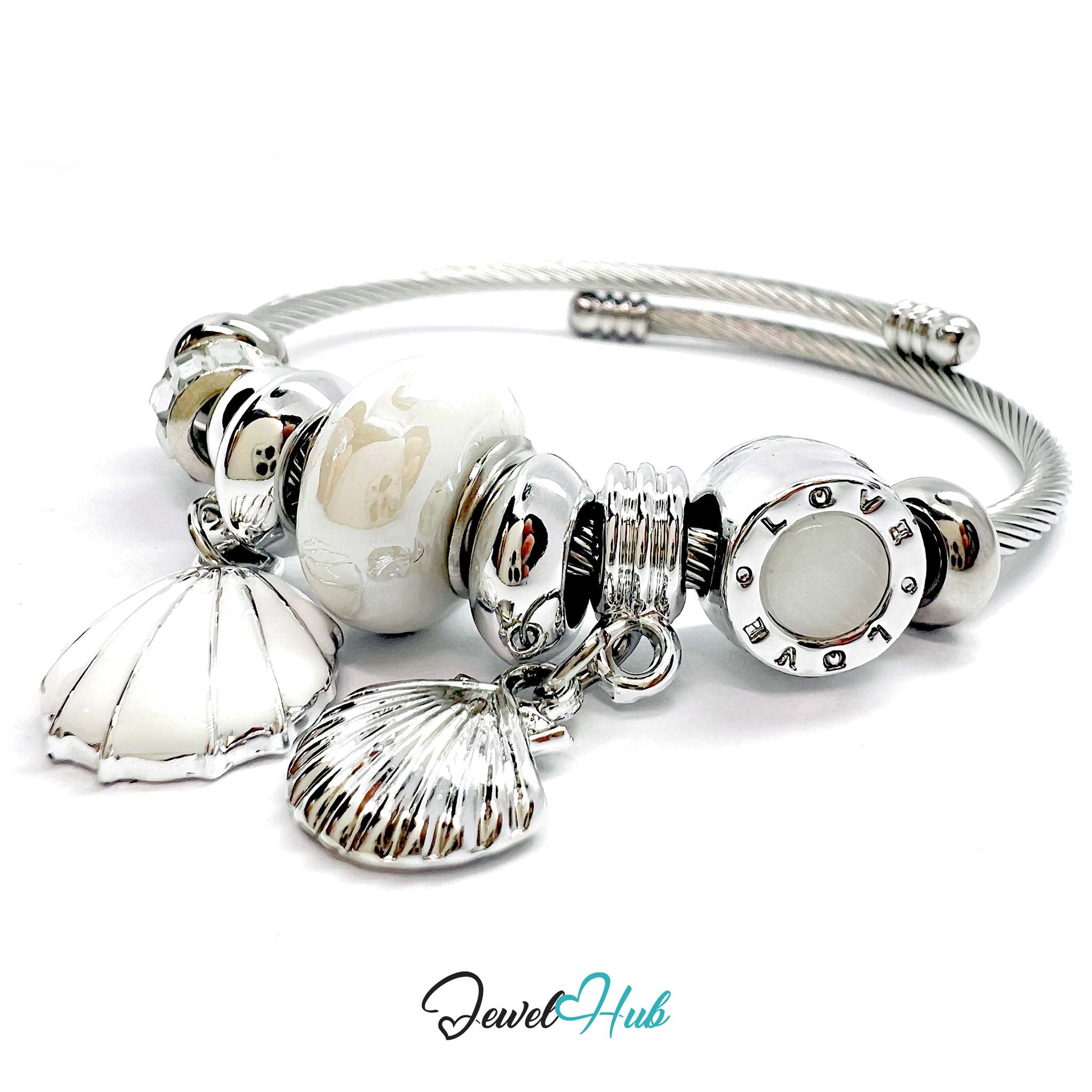 Silver bracelet with shell and round bead charms on a white background, branded 'Jewel Hub'.