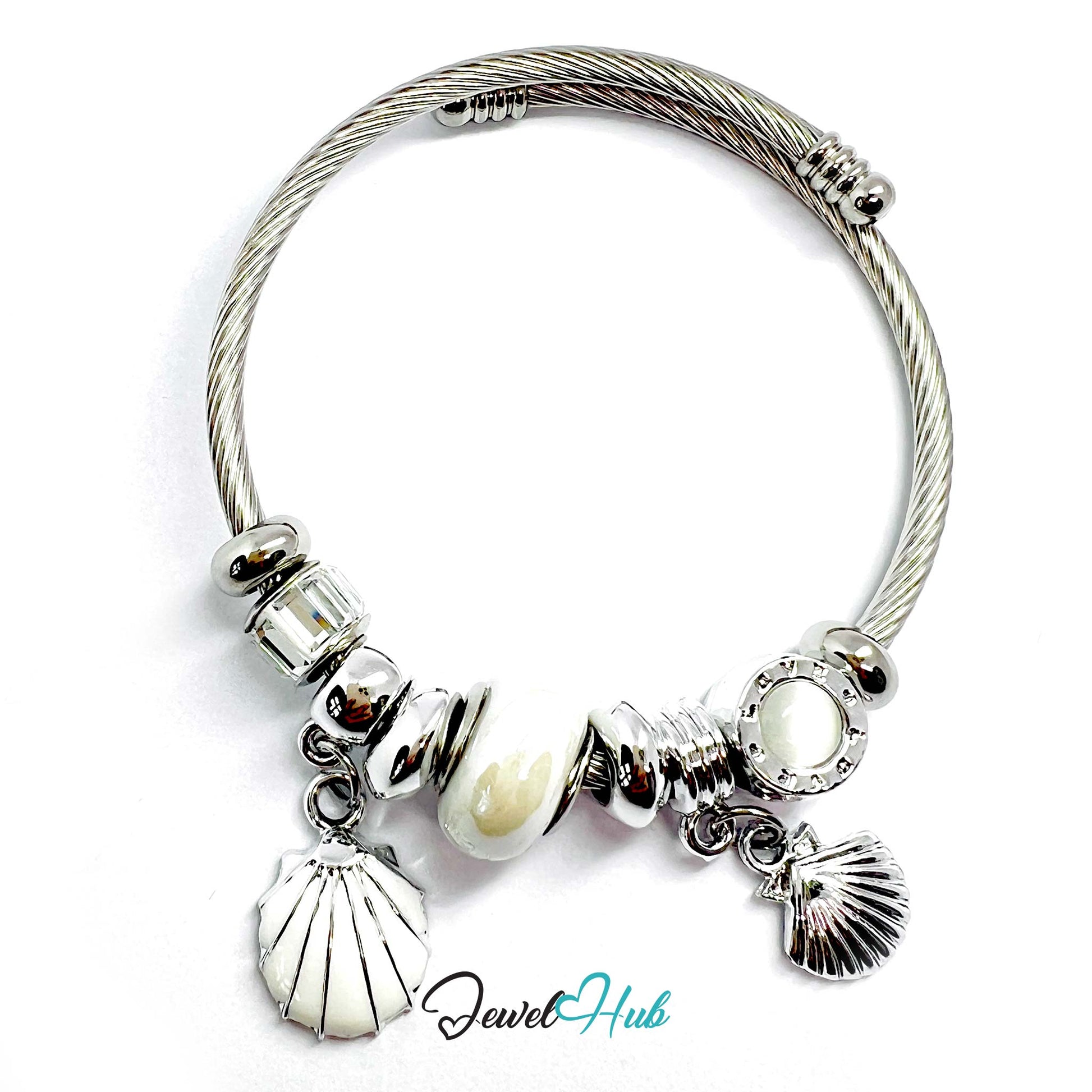 Silver bracelet with shell and pearl charms on a white background, branded 'Jewel Hub'.