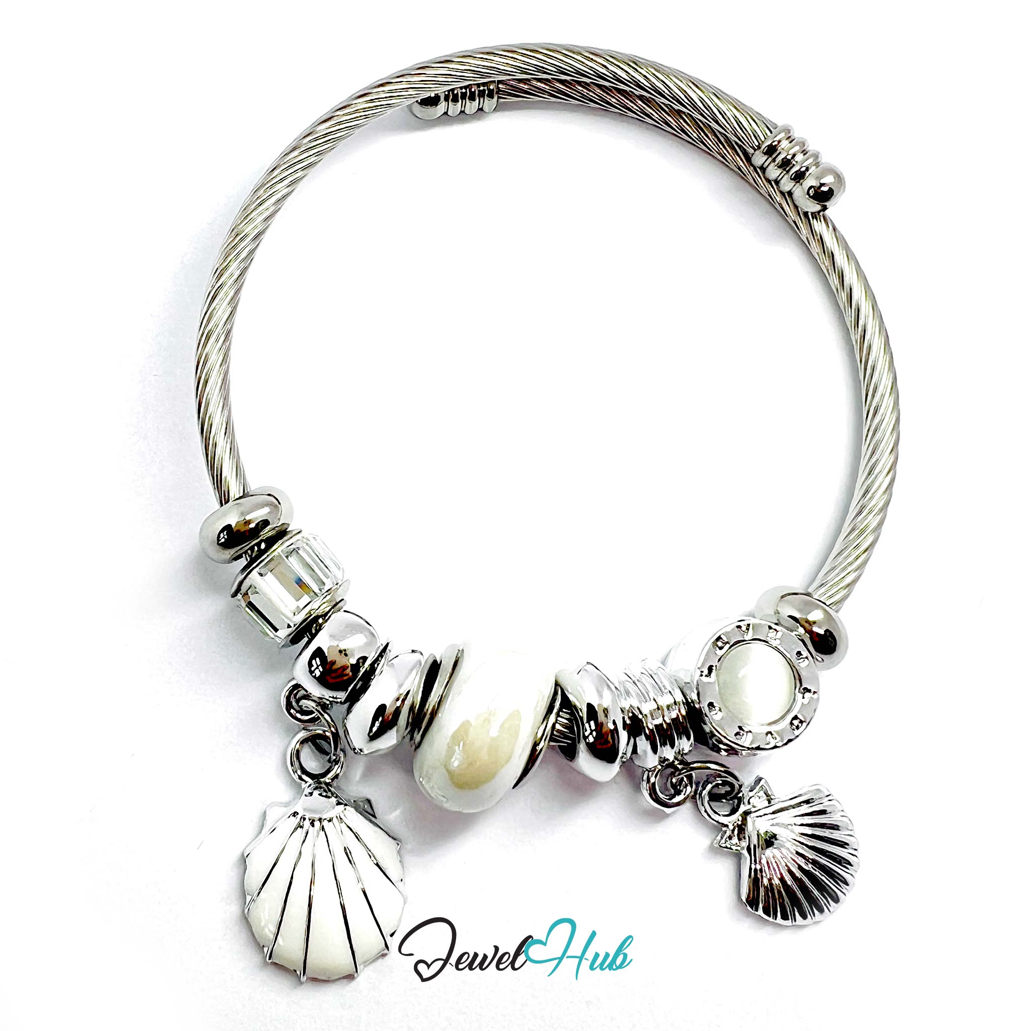 Silver bracelet with shell and pearl charms on a white background, branded 'Jewel Hub'.