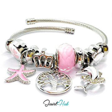 Silver bracelet with pink and gold charms on a white background, featuring the brand 'Jewel Hub'.