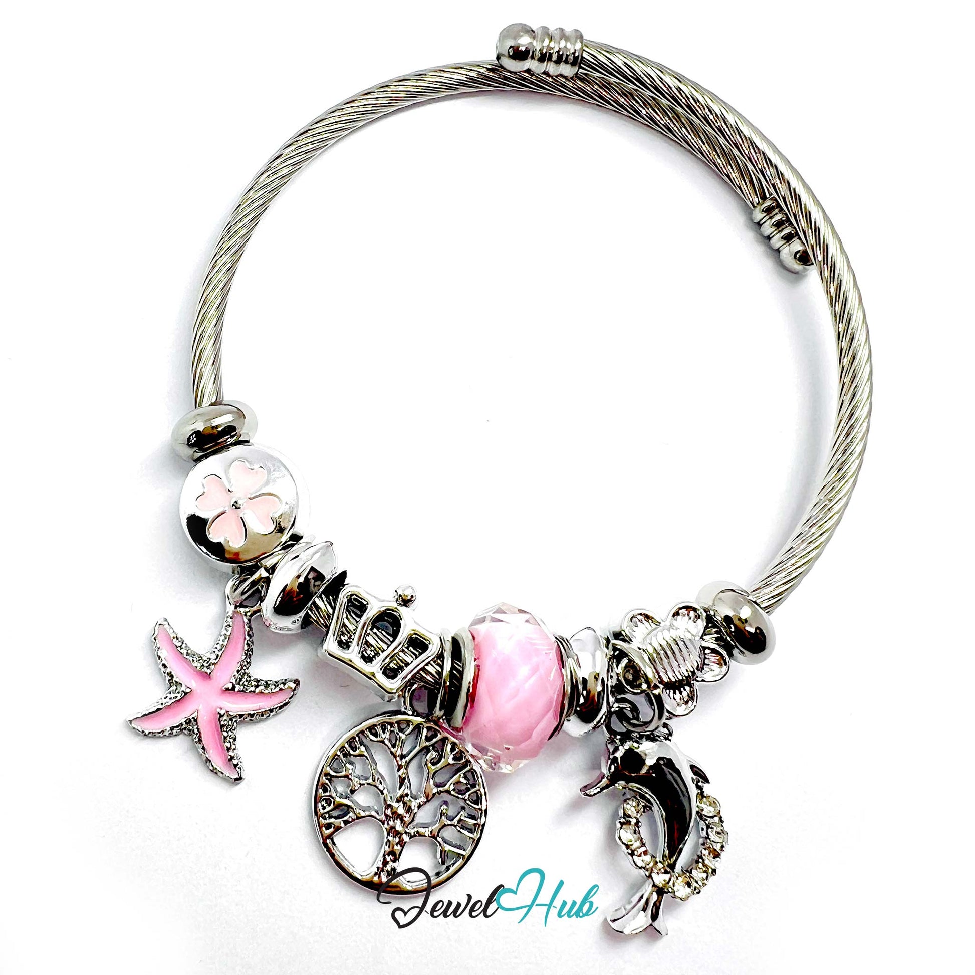 Bracelet with various charms including a starfish, tree of life, and moon, on a white background.